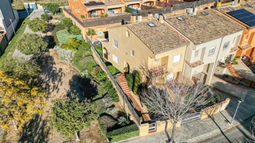 Aerial view of Finques Garcia Enrich property in Palafrugell showing terracotta-roofed buildings with Mediterranean gardens