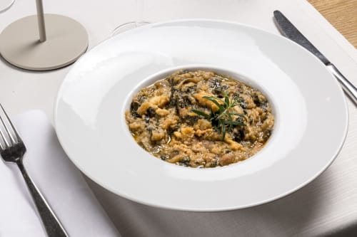 Creamy risotto with mushrooms and herbs at Palazzo Belvedere, Chianciano Terme