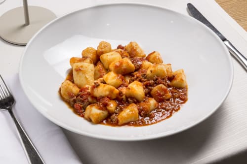 Gnocchi in tomato ragù sauce served at Palazzo Belvedere hotel in Chianciano Terme, Italy