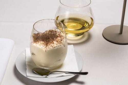 Elegant dessert with cocoa powder at Palazzo Belvedere, Chianciano Terme, paired with white wine