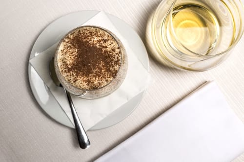 Tiramisu dessert with cocoa powder at Palazzo Belvedere hotel in Chianciano Terme, Italy