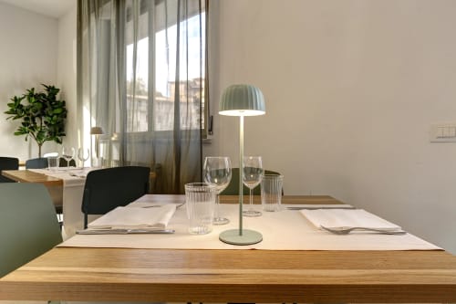 Elegant dining room at Palazzo Belvedere hotel in Chianciano Terme with modern table setup and natural light