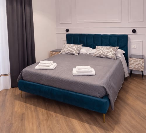 Pulcinella room with spacious layout and custom furnishings at La Boutique del Centro