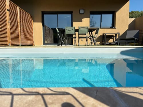 Villa Lagon Bleu pool terrace with heated swimming pool, dining area, managed by Corsu di Core conciergerie