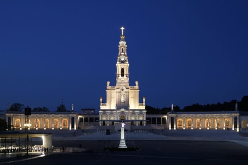 Illuminated Sanctuary of Fátima basilica at dusk, Portugal, near Quinta da Alcaidaria-Mór