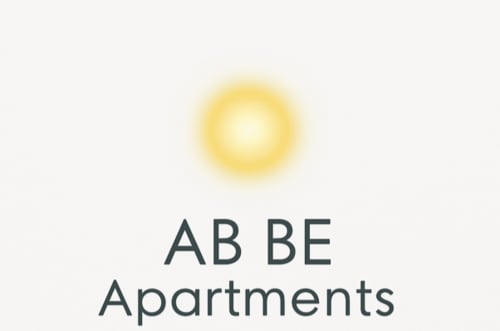 Logo de Ab Be Apartments con icono de sol, gestor de propiedades en Málaga