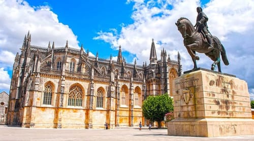 Historic Gothic monastery with equestrian statue in Ourém-Fátima, Portugal near Quinta da Alcaidaria-Mór
