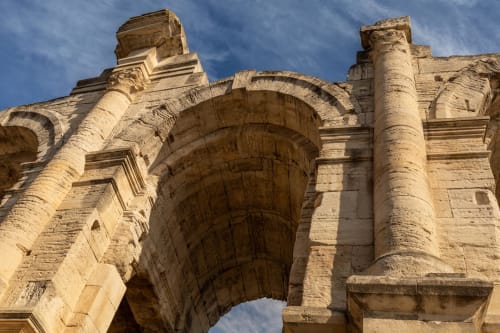 Ancient stone archway with columns at Le Prieuré Notre-Dame in Montfrin, France