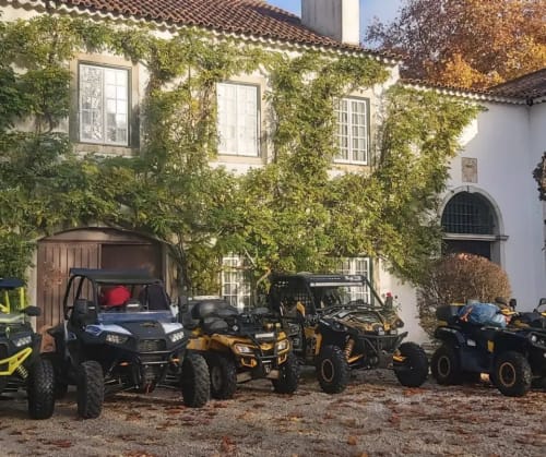 ATV and buggy fleet parked at Quinta da Alcaidaria-Mór B&B courtyard in Ourém-Fátima
