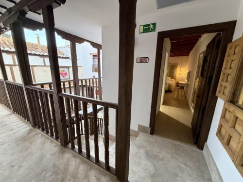 Room 205 hallway at Complejo Turístico Retiro del Teatro, Almagro, with wooden railings and doors