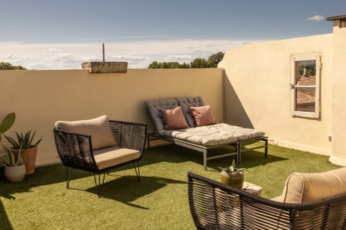 Le Prieuré Notre-Dame rooftop terrace with seating and artificial turf in Montfrin