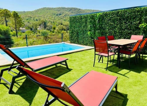 Villa Corail pool area in Favone with lounge chairs, dining table, and mountain views, managed by Corsu di Core