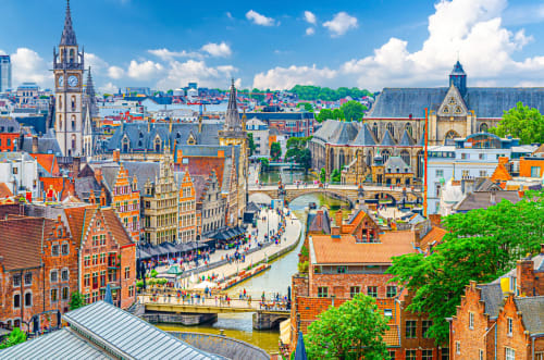 Medieval Ghent cityscape with colorful buildings, canal, and historic architecture near Merelbeke