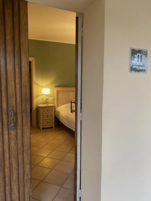 Bedroom doorway at Le Campanule room, Agriturismo Colle Mura in Gualdo Tadino, Italy