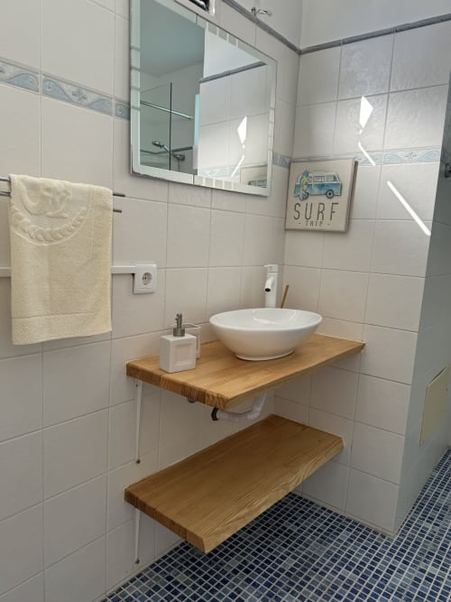 Modern bathroom vanity with white bowl sink at Check Madeira hotel in Ribeira Brava, Portugal