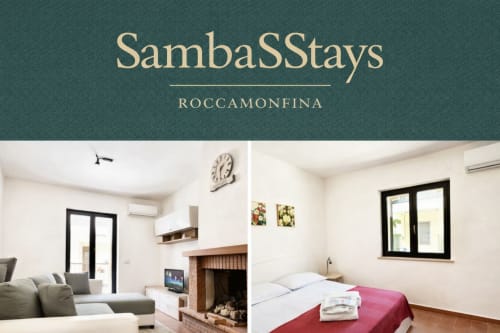 Interno dell'appartamento SambaSStays a Roccamonfina con salotto camino e camera da letto con vista giardino