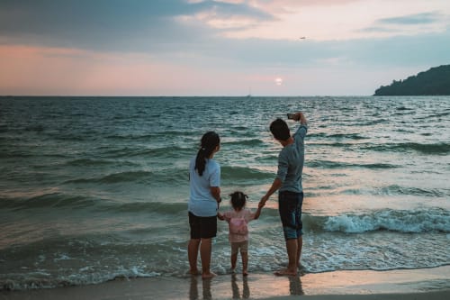 Family enjoying sunset at Costa Adeje beach near Marigold Property Services apartment