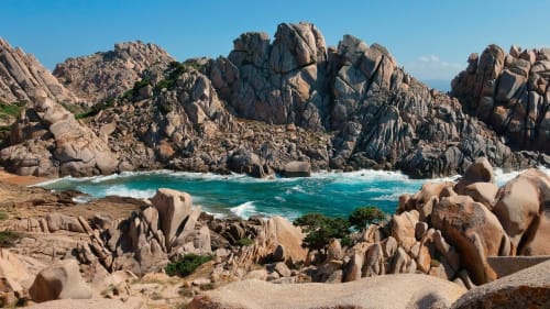 Dramatic granite rock formations frame turquoise waters at Costa Adeje, Tenerife beach near Marigold Property Services