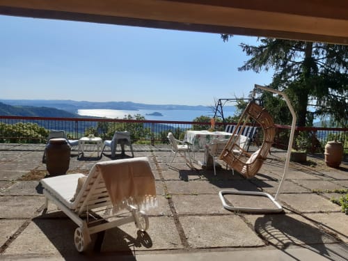 Belvedere del Lago terrace with lounge chairs overlooking Lake Bolsena, Montefiascone, Italy