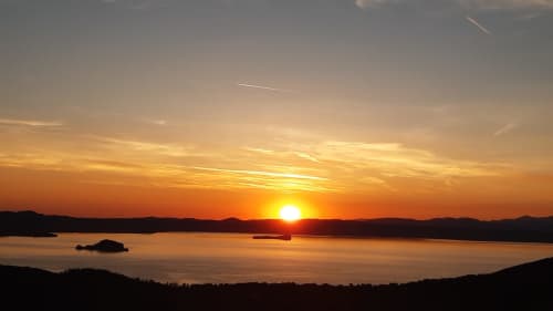 Golden sunset over Lake Bolsena from Belvedere del Lago balcony, Montefiascone