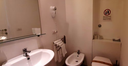 Bathroom in Peonia room at Belvedere del Lago, Montefiascone with sink, bidet, toilet and shower fixtures