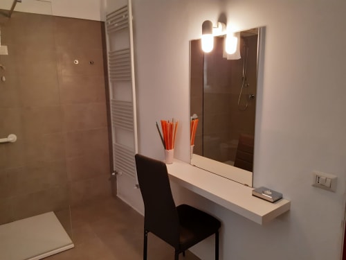 Modern bathroom vanity with mirror and lighting at Belvedere del Lago, Montefiascone