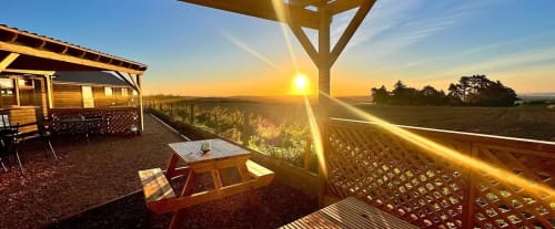 Sunset view from Three Little Pigs terrace overlooking Blandford Forum countryside with picnic table