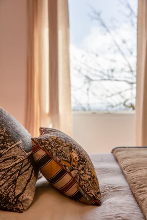 Decorative pillows on bed in Suite Mont Blanc at Villa Figue Blanche, Montagny-les-buxy, with snowy mountain view through