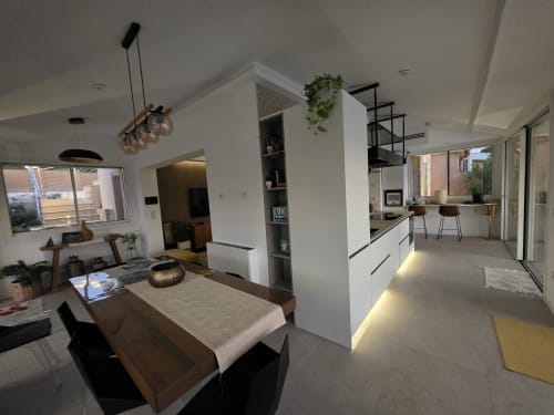 Modern luxury villa dining and kitchen area in Cagliari with sea views, contemporary design, and open-plan living space
