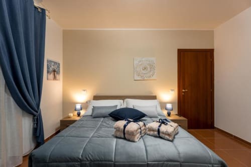Mistral Room at Torre dei Venti B&B in Ceccano with queen bed, garden view, and modern amenities