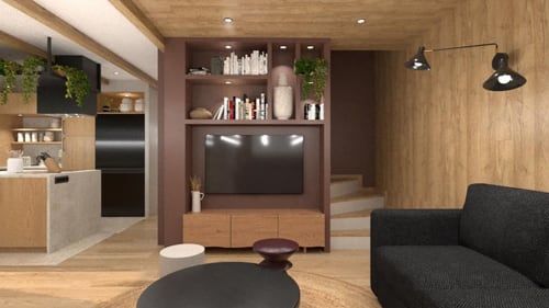 Espace de vie Villa Acacia aux Villas de Jade avec cuisine moderne, centre de divertissement et canapé noir à Saint-Brevin les