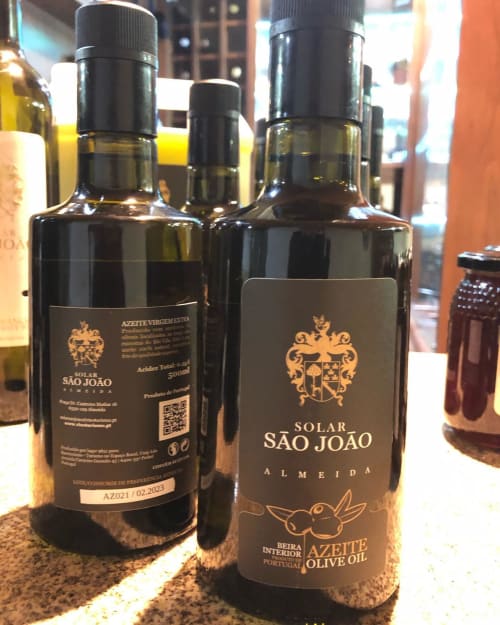 Solar São João premium olive oil bottles from Almeida, Portugal displayed at Risoturismo property