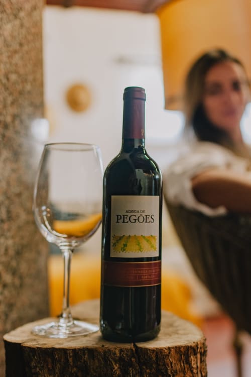 Adega de Pegões wine bottle and glass at Herdade da Cova da Onça guesthouse in Canha, Portugal