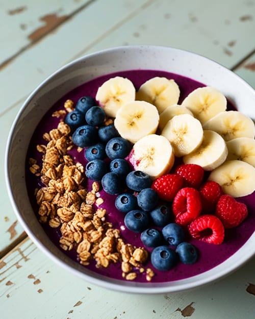 Colorful acai bowl with granola, banana, blueberries and raspberries at The Village Inn B&B, Killarney