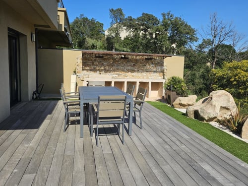 Furnished wooden deck terrace with dining table at Villa Ô Bord de Mer, managed by Corsu Di Core, Favone