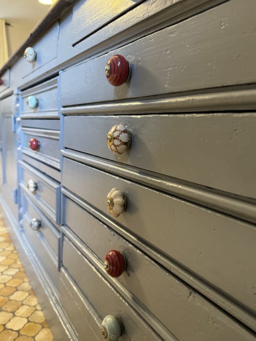 Close-up of vintage drawer pulls on grey dresser in Gîte Le Jardin cottage at Domaine de Bort near Limoges