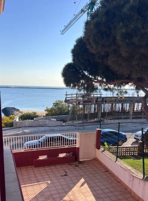 Brisa Marina apartment balcony overlooking Mazagon beach and Mediterranean Sea with construction crane visible