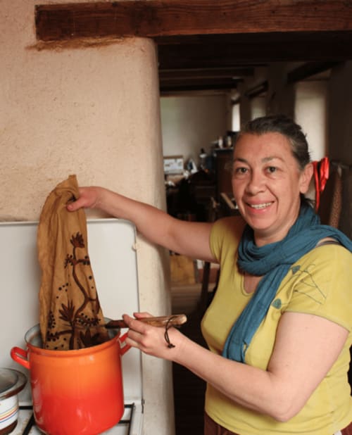 Woman holding a decorative fabric at La Cachette d'Oona B&B in Saint-Jean-de-Monts, France