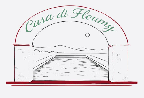 Entrée en arche de la Casa di Floumy avec piscine à Calvi, France - accueil chaleureux du gîte