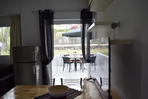 Modern apartment dining area with open terrace access in Costa Adeje, Tenerife