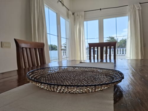 Modern dining area with waterfront views at Villas del Mar, Puerto Calero. Elegant table setting overlooking private pool and
