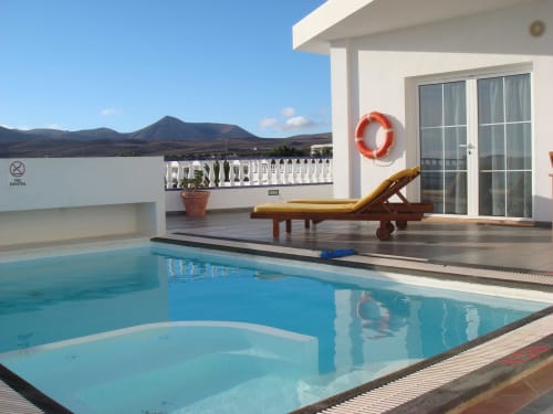 Private villa pool terrace with mountain views at Villas del Mar, Puerto Calero, Lanzarote