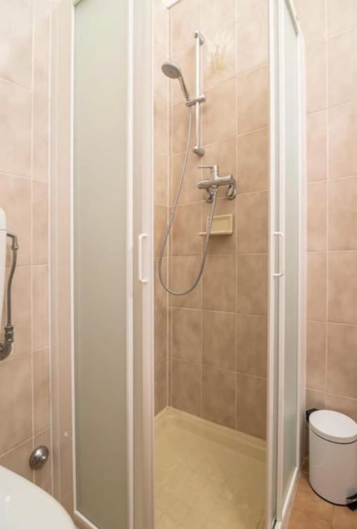 Modern shower enclosure with glass doors at La Dolce Casa bed and breakfast in Cremia, Italy