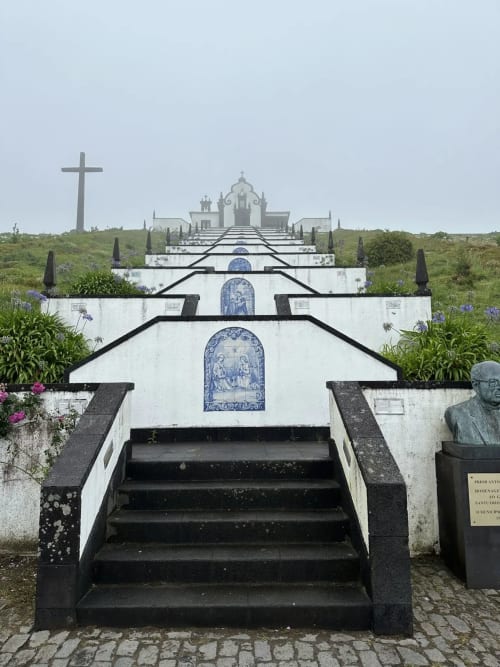 Sacred chapel staircase with blue tile azulejos and cross, Azores Portugal landmark