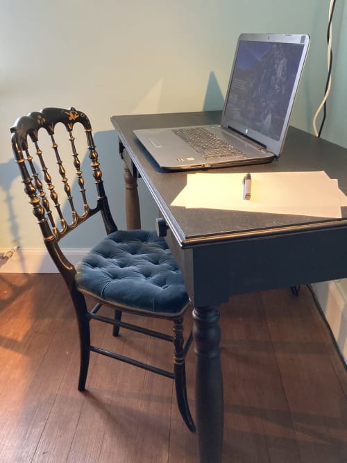 Workspace at Clos d'Azel with laptop, ornate black authentic Napoléon chair