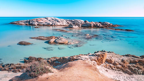 Turquoise waters and granite rocks at Muravera beach, Sardinia near Hotel Ristorante Domu Incantada