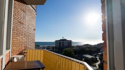 Balcony view of Como coastline and mountains from Versilia Panoramic Luxury apartment with sea vista