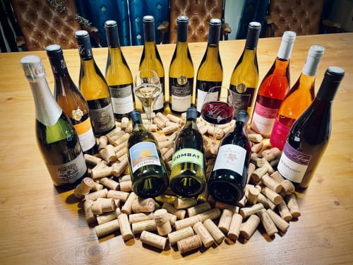 Wine collection display with corks at Domaine Joseph Lafarge Wine Resort in Lugny, France