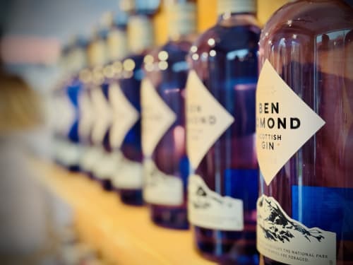 Row of Ben Edmond Scottish gin bottles displayed at The Corries Bed and Breakfast in Luss, Alexandria