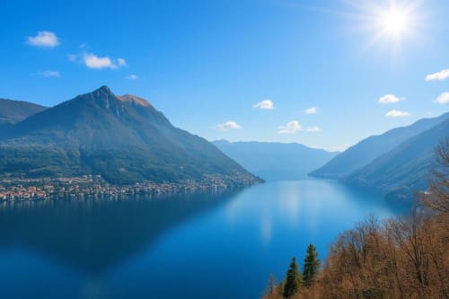 Scenic alpine lake surrounded by mountains and a lakeside town in Como, Italy, mountain view from Residenza Vecchio Faggeto
